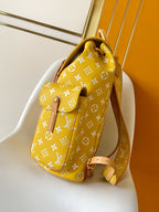 Louis Vuitton yellow monogram hobo bag with top handle and adjustable shoulder strap