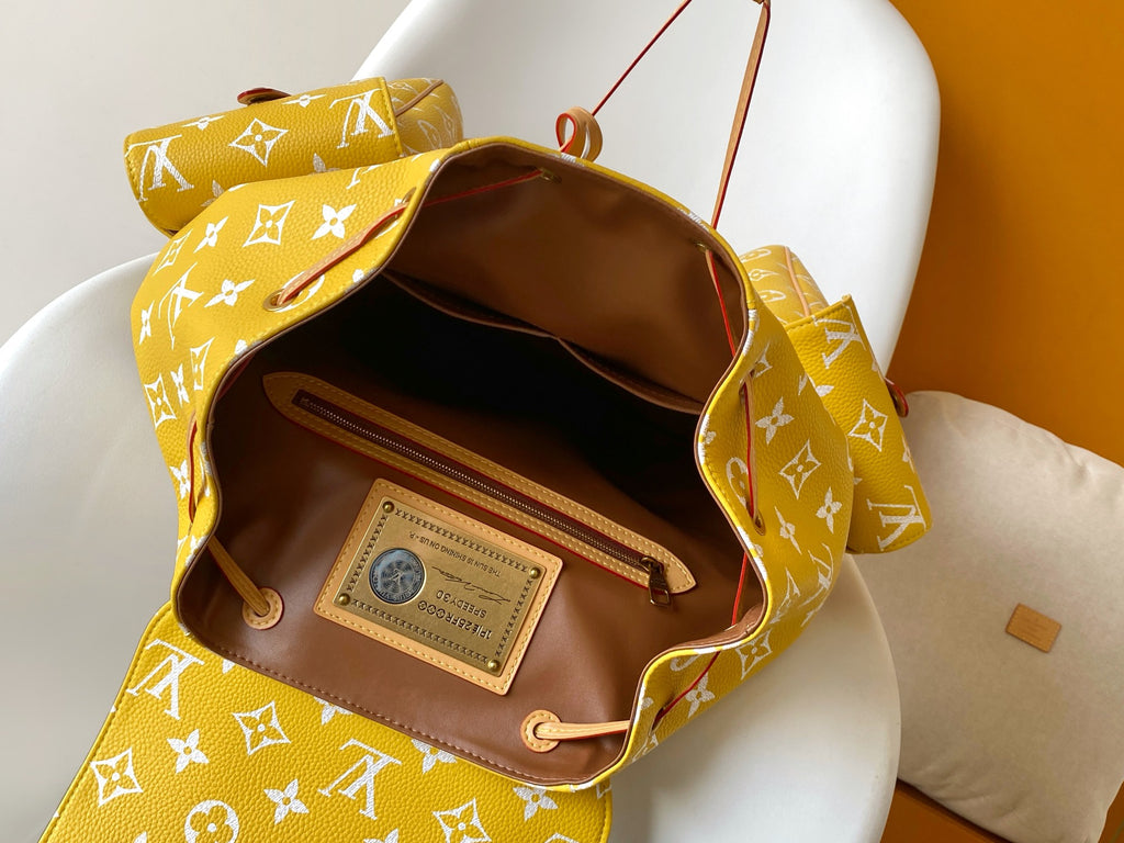 Louis Vuitton yellow monogram bag interior with brown lining and leather ID card pocket
