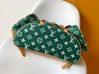 Louis Vuitton green monogram pouch bag with tan piping and zipper pull