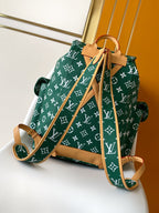 Louis Vuitton green monogram drawstring bag with tan straps and bottom