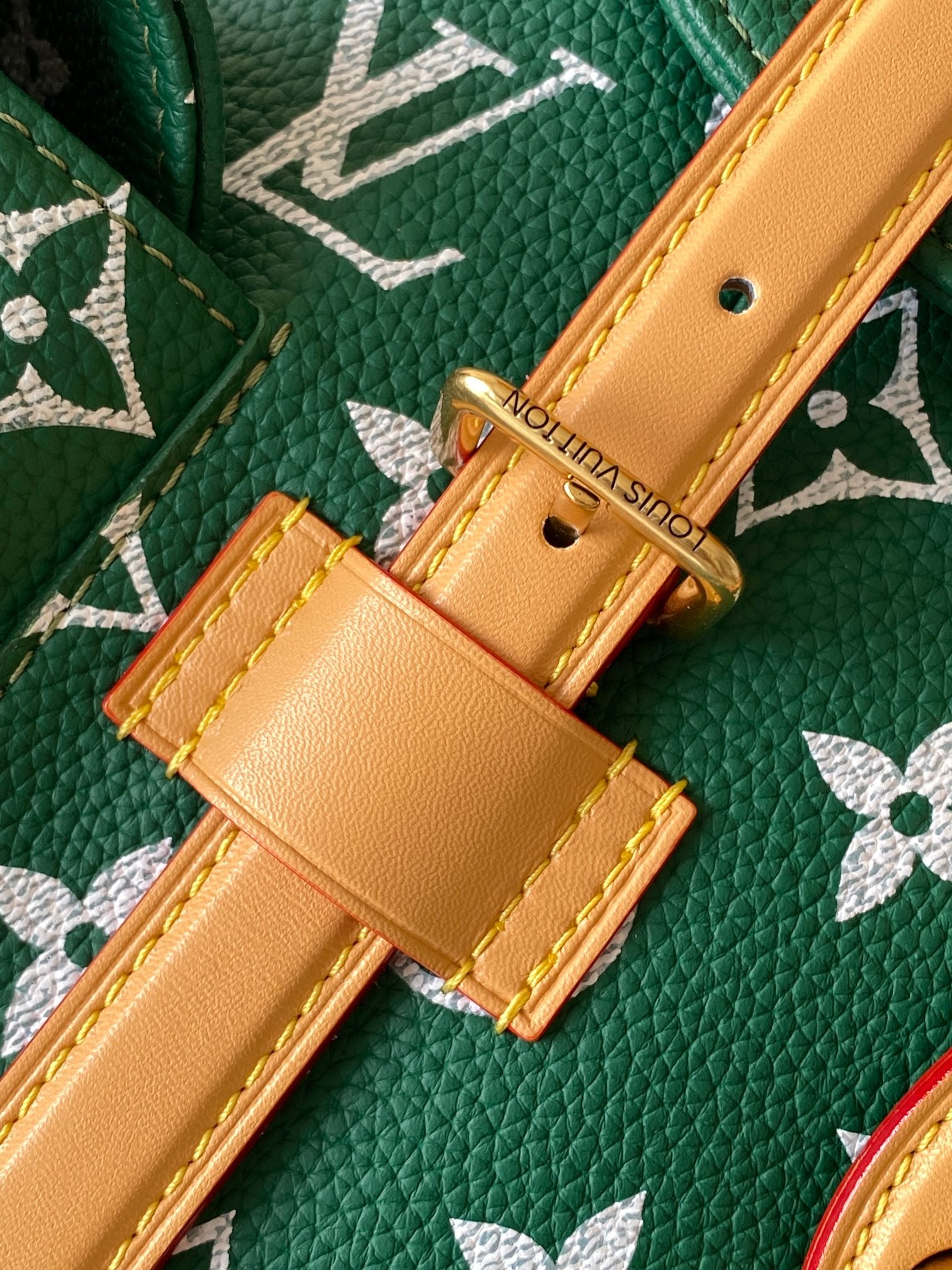 Louis Vuitton green monogram leather strap with gold buckle and tan hardware