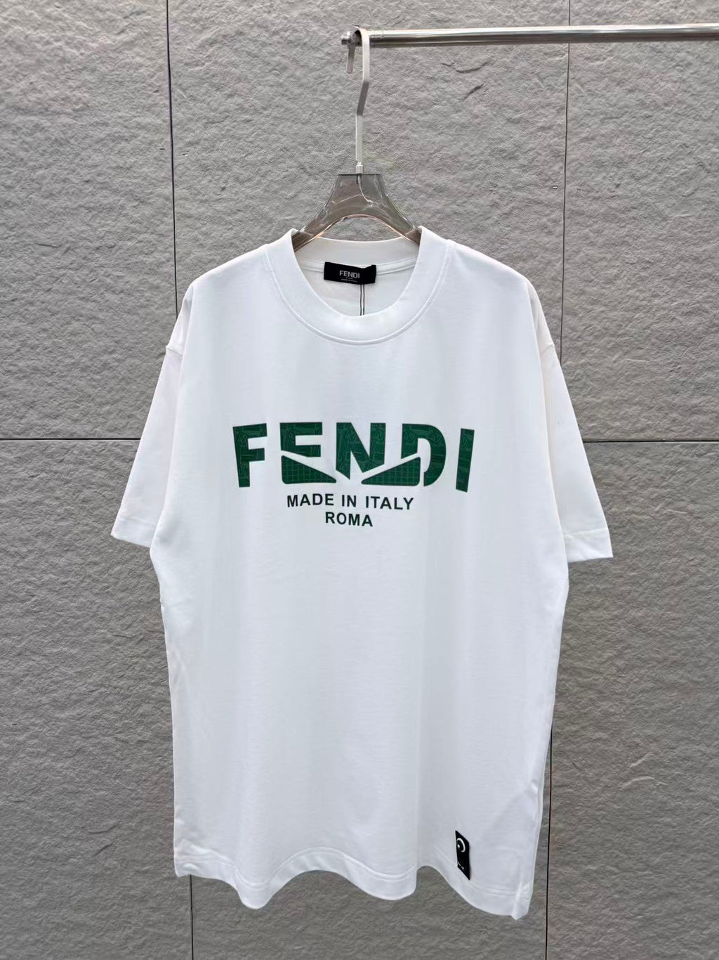 White Fendi short-sleeve T-shirt with green FENDI logo and 'Made in Italy' print