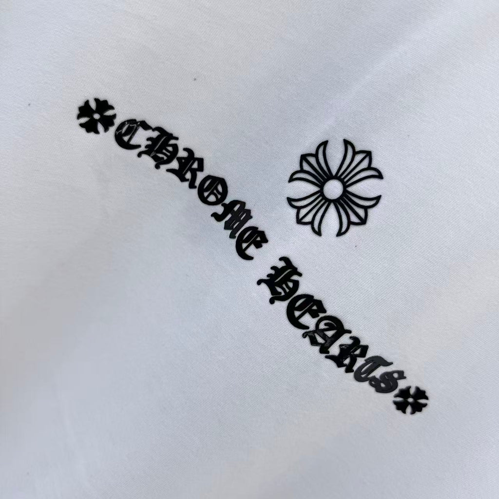 Black graphic text with flower icon on white T-shirt