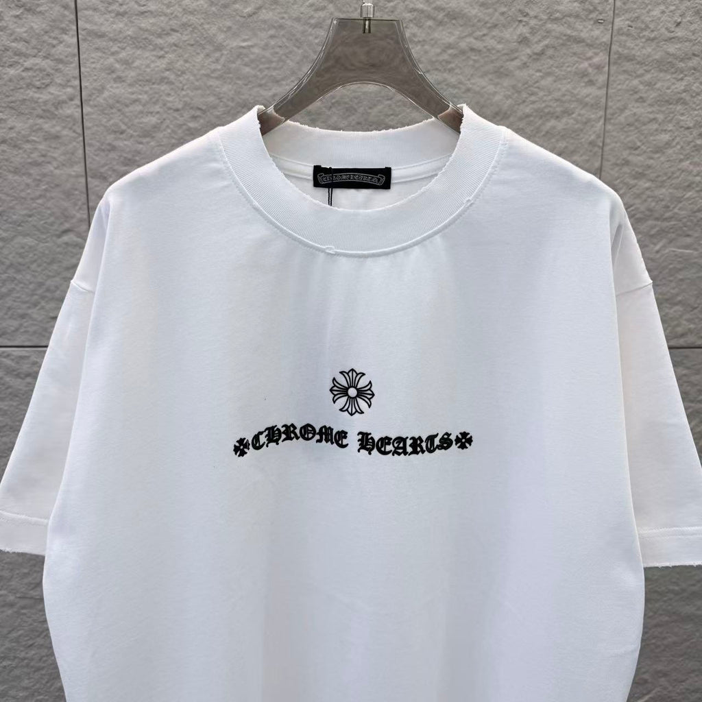 White T-shirt with crew neck and black chest logo with flower graphic