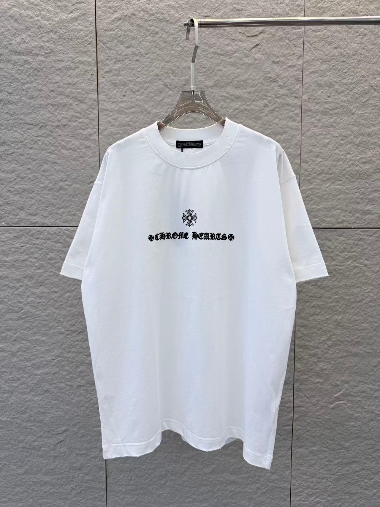White short-sleeve T-shirt with small black chest graphic print