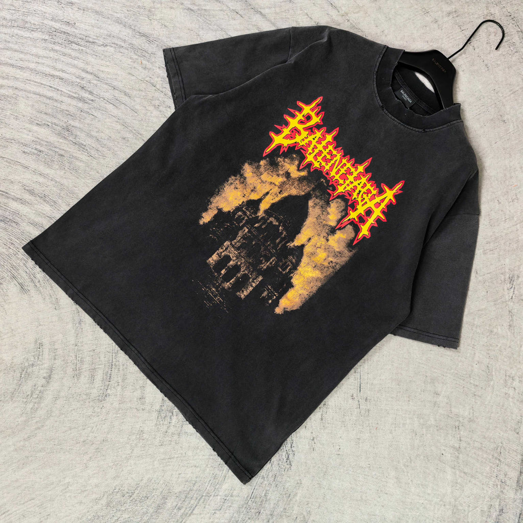 Black graphic T-shirt with red/yellow cathedral print, folded on hanger