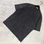 Black graphic T-shirt laid flat, plain back with short sleeves