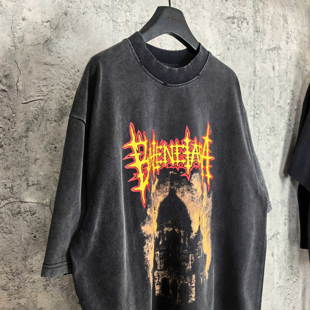 Black graphic T-shirt with red/yellow cathedral graphic on the chest