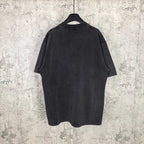 Black graphic T-shirt back view on hanger, plain