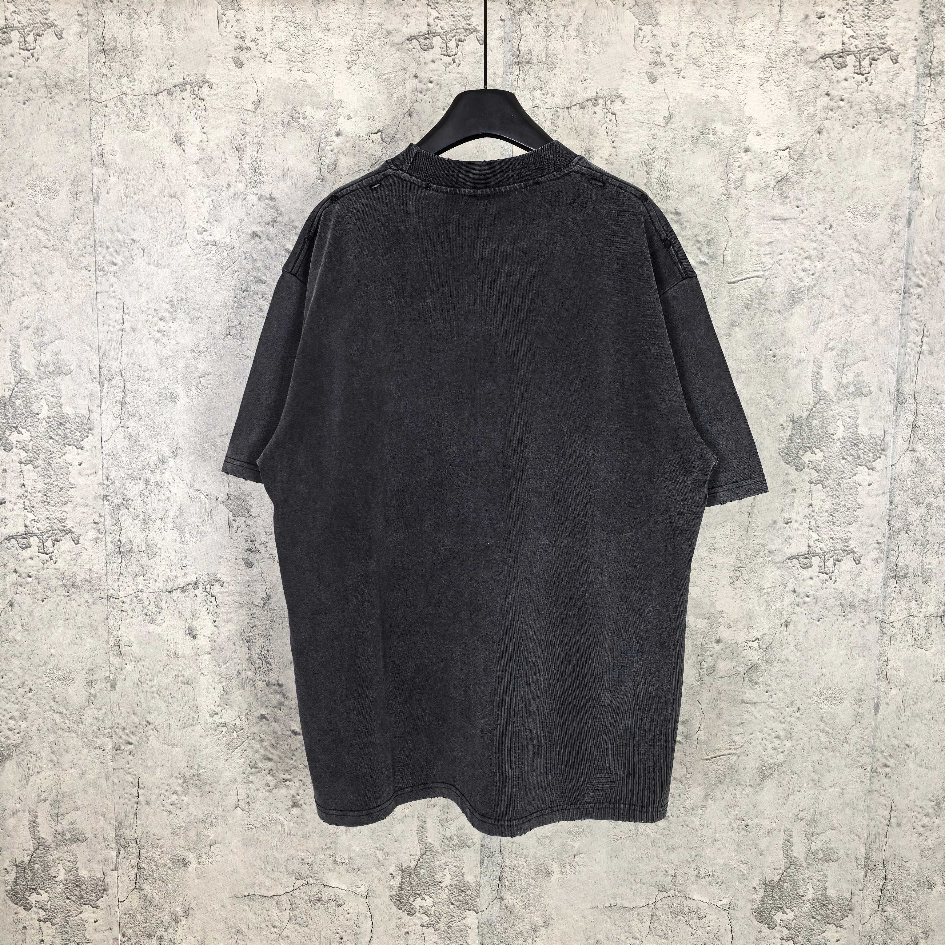 Black graphic T-shirt back view on hanger, plain