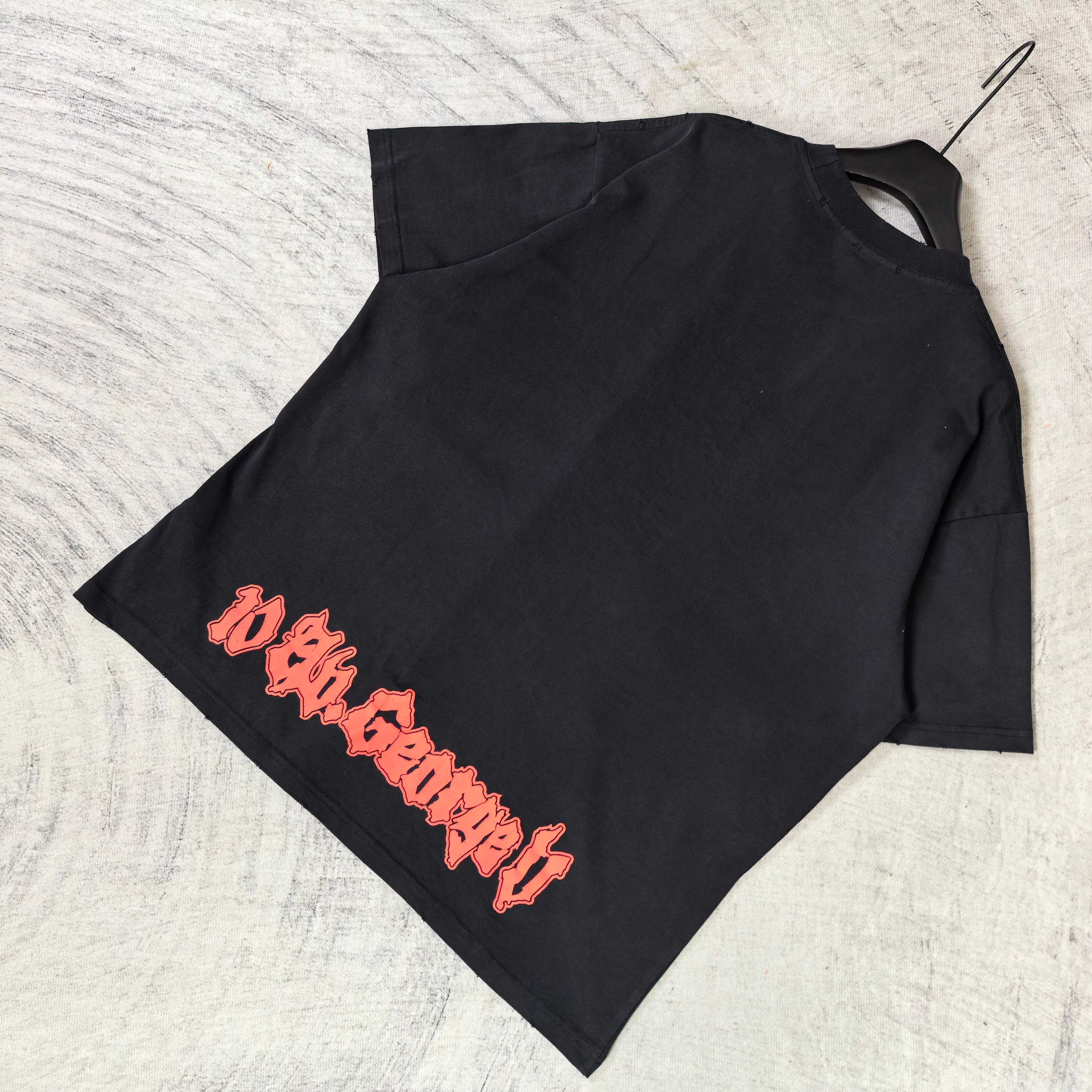 Black graphic T-shirt with red diagonal lettering on front, short sleeves