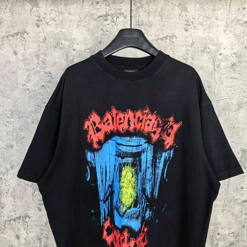 Black graphic T-shirt with colorful blue and yellow face artwork and red text