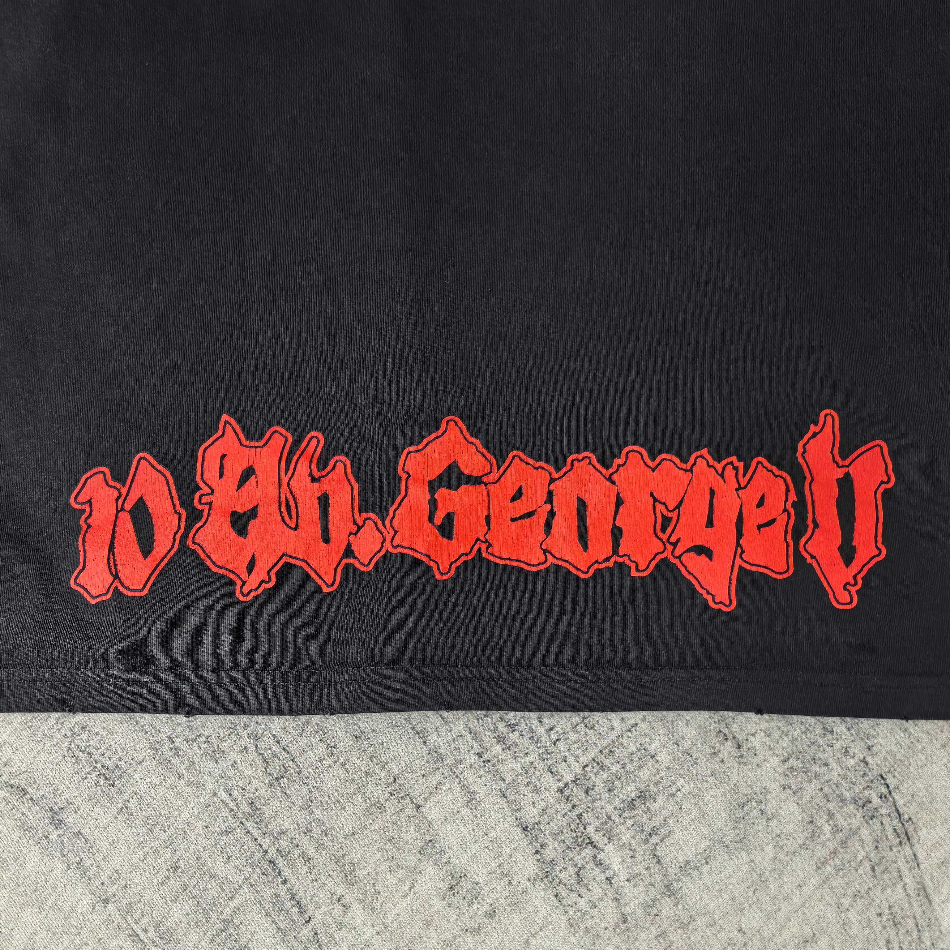 Black graphic T-shirt close-up of red stylized lettering