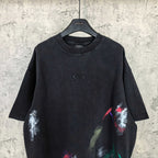 Balenciaga short-sleeve T-shirt, black with small chest logo and colorful paint graphic