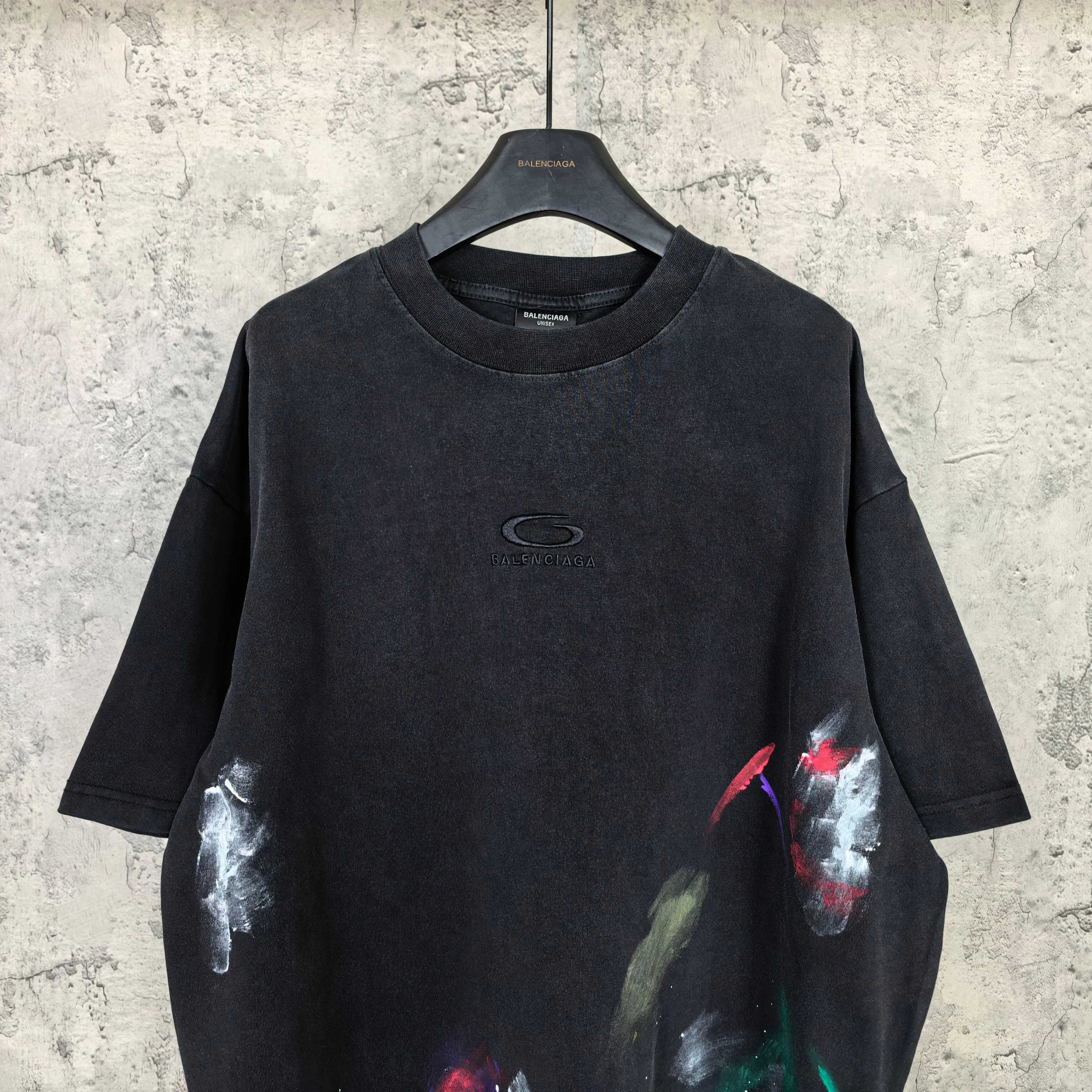 Balenciaga short-sleeve T-shirt, black with small chest logo and colorful paint graphic