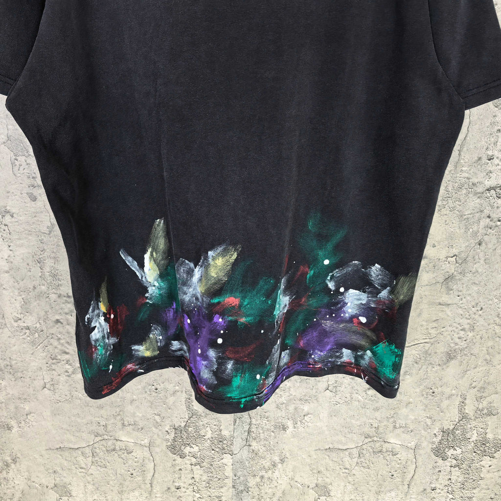 Balenciaga short-sleeve T-shirt close-up hem, black with colorful abstract paint splatter