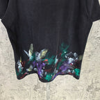 Balenciaga short-sleeve T-shirt close-up hem, black with colorful abstract paint splatter