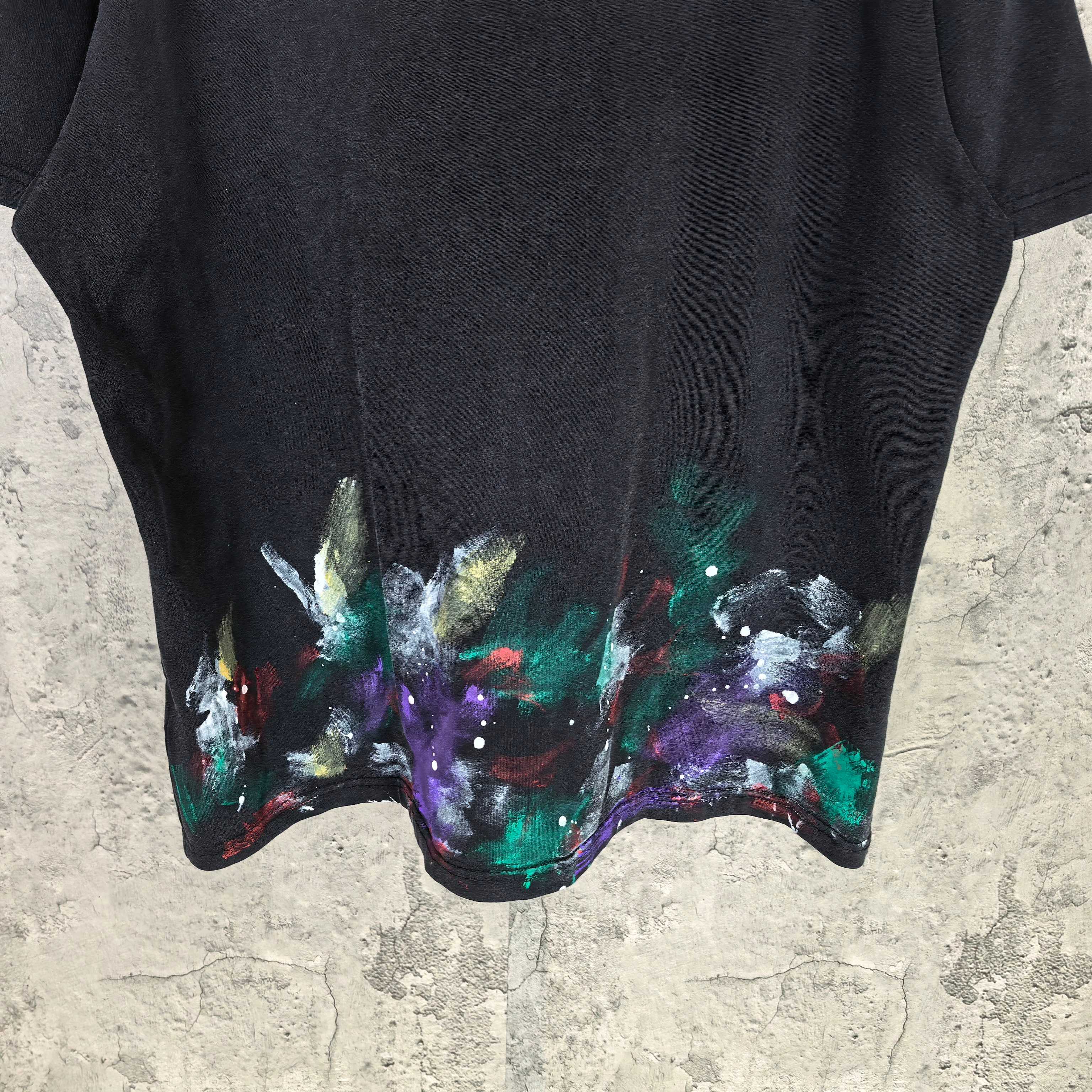 Balenciaga short-sleeve T-shirt close-up hem, black with colorful abstract paint splatter