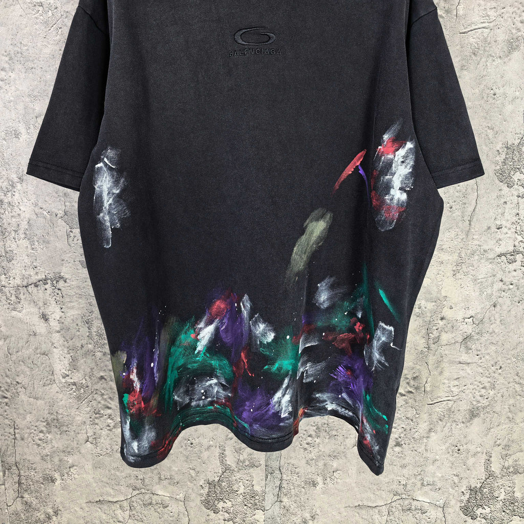Balenciaga short-sleeve T-shirt front, black with large colorful abstract paint print on hem