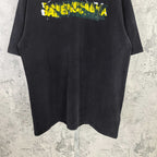 Black short-sleeve T-shirt with Balenciaga logo print near the chest.