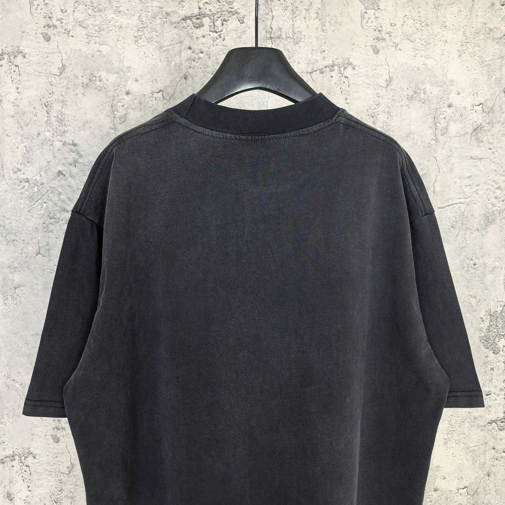 Black short-sleeve T-shirt, back view with crew neck and loose shoulders.