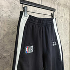 Black shorts with white side stripes, NBA and Balenciaga logos, front view