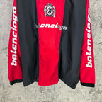 Balenciaga long pants in red and black with crest and white logo print