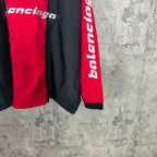 Balenciaga long pants with red side panel and vertical white logo near hem