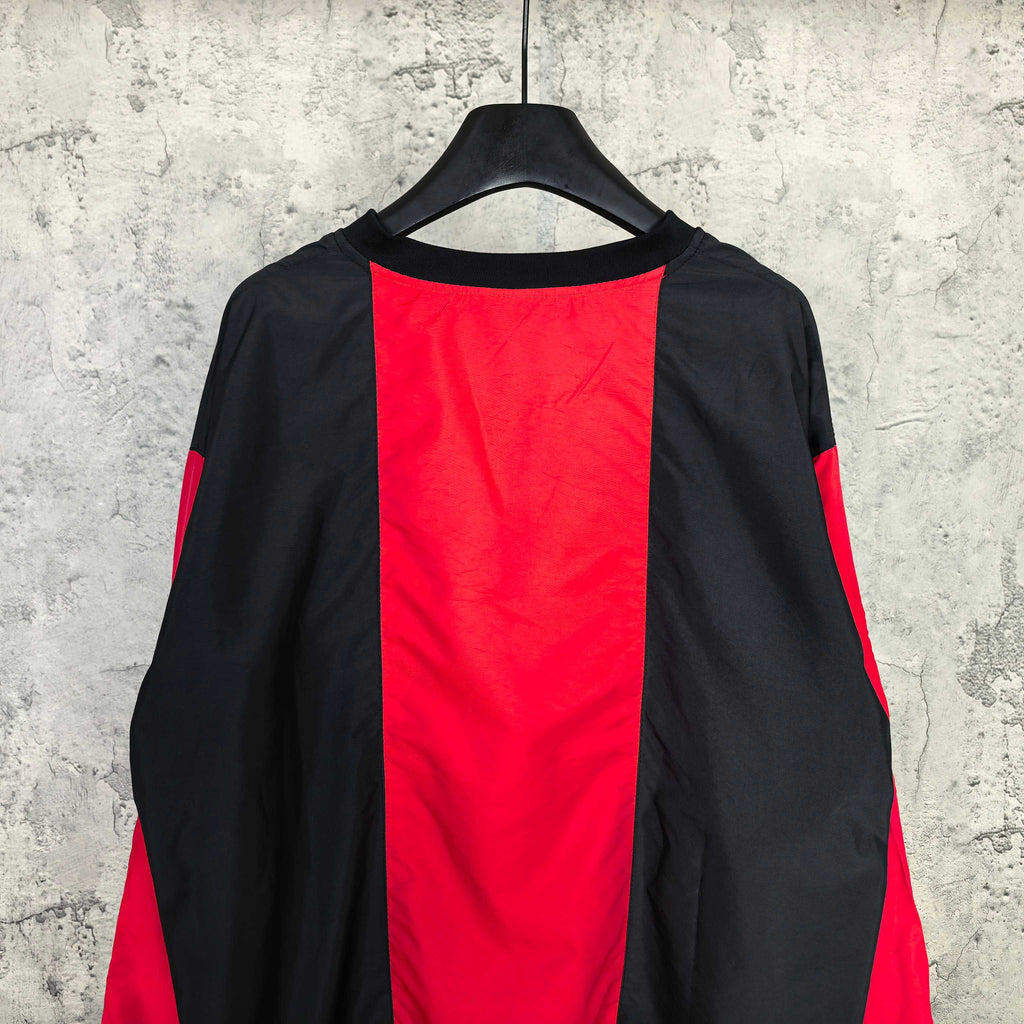 Long-sleeve Balenciaga jersey back view with black base and vertical red center panel.