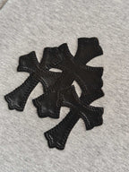 Light gray hoodie fabric with black embroidered cross emblem