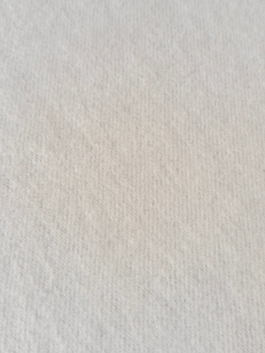 Light gray knit hoodie fabric texture, no visible hardware