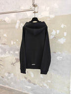 Dark zip-up hoodie back view with hood and full-length zipper