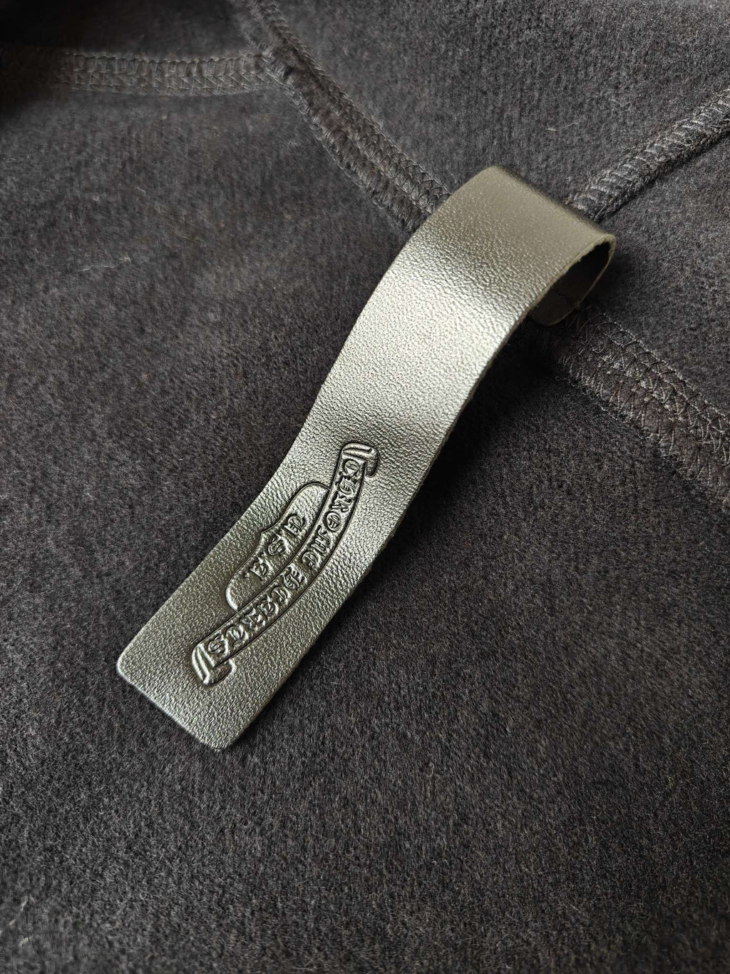 Hoodie label patch on dark fabric