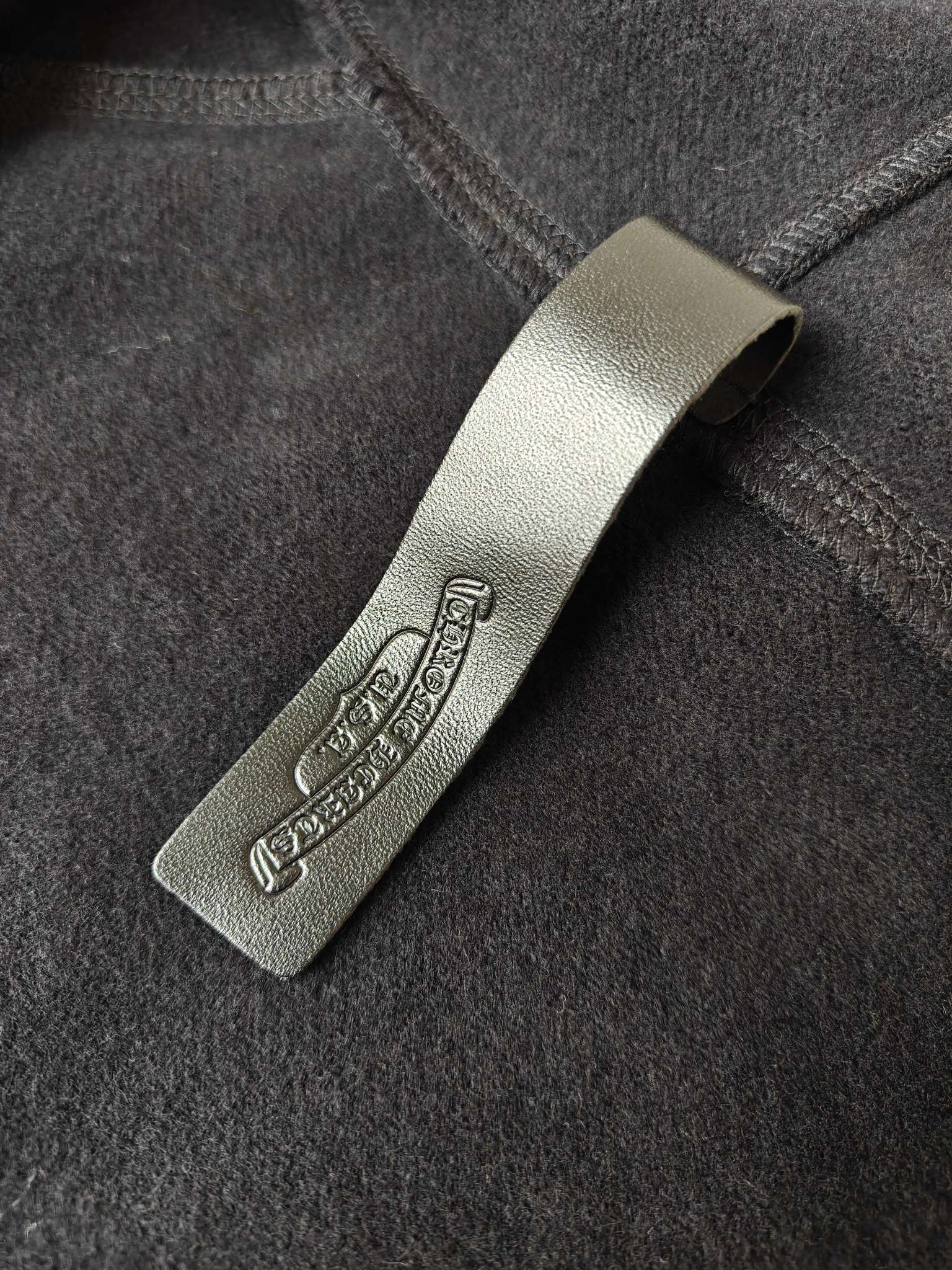 Hoodie label patch on dark fabric