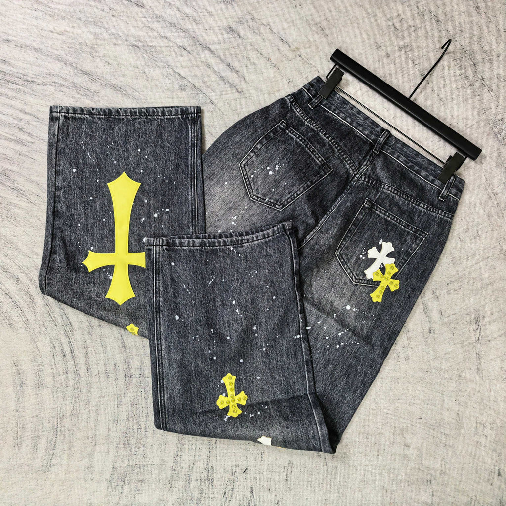 Set of dark denim pants with yellow cross prints and white speckled paint