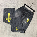 Set of dark denim pants with yellow cross prints and white speckled paint