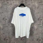 White short-sleeve T-shirt with blue drip graphic on the chest
