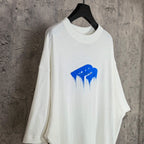 White short-sleeve T-shirt with blue drip graphic and crew neck