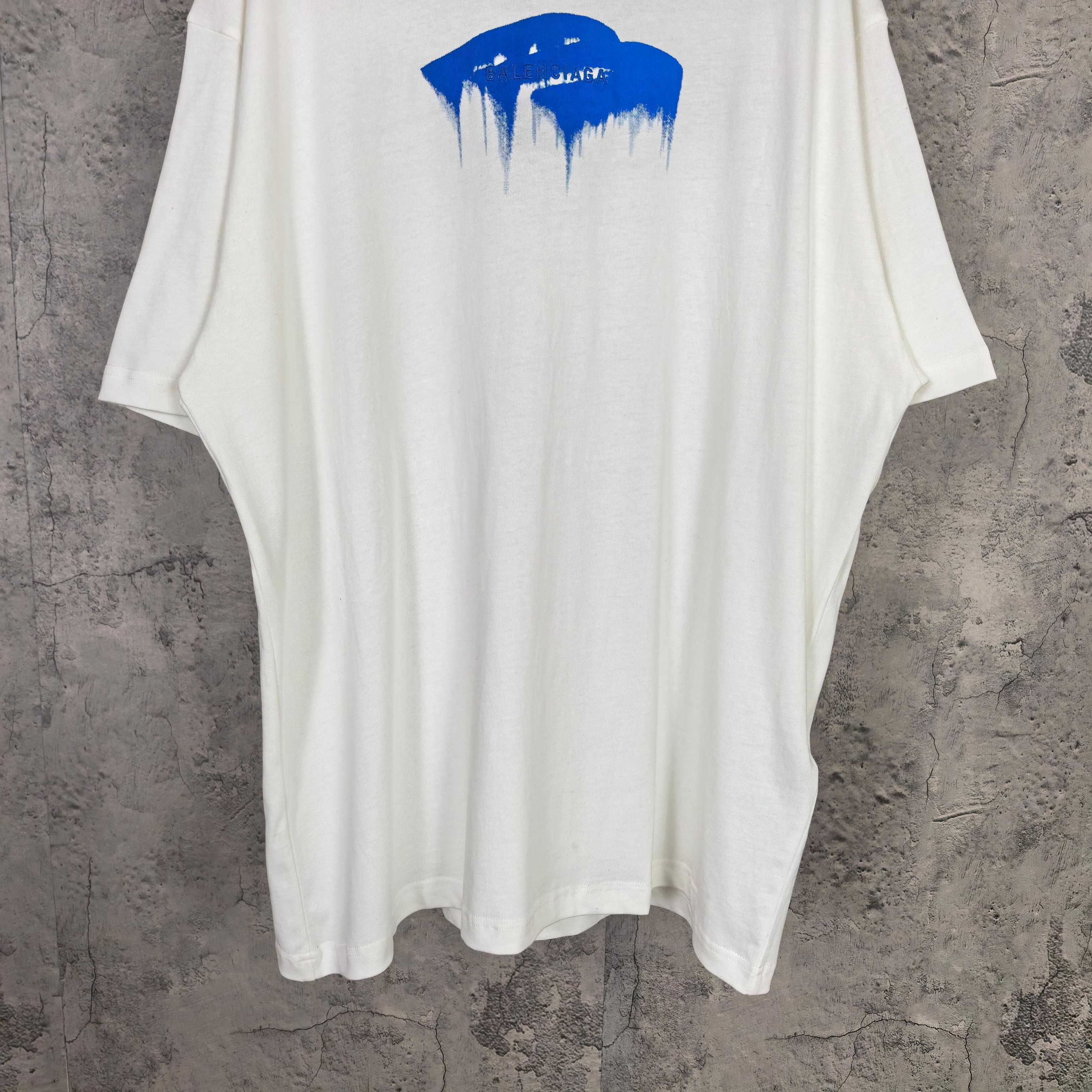 White short-sleeve T-shirt with centered blue drip graphic