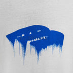 Blue drip graphic with faint text on a white T-shirt