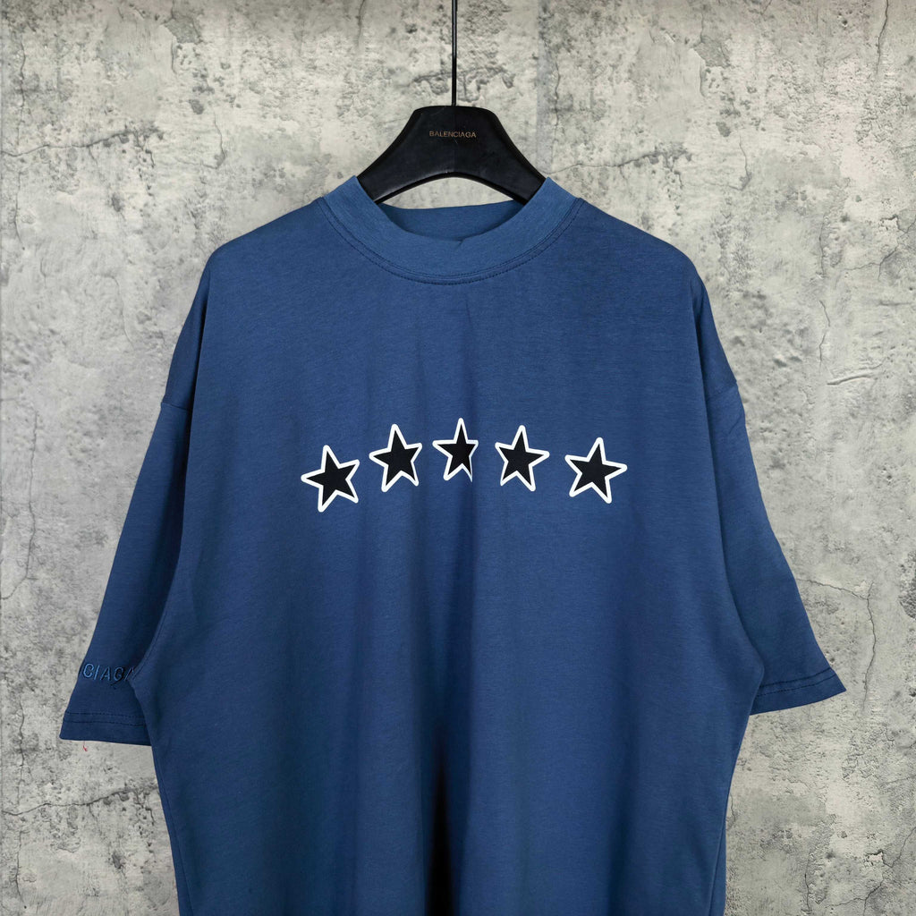 Balenciaga short-sleeve T-shirt in blue with five white outlined stars on front.