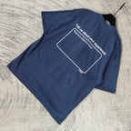 Balenciaga short-sleeve T-shirt, blue, folded; back message in white outline box.