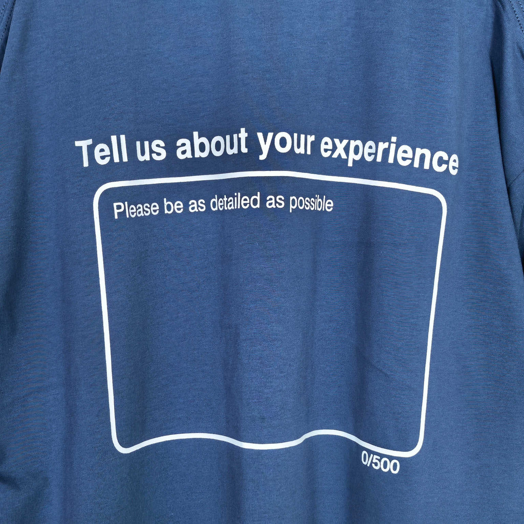 Balenciaga short-sleeve T-shirt detail: white 'Tell us about your experience' text box.