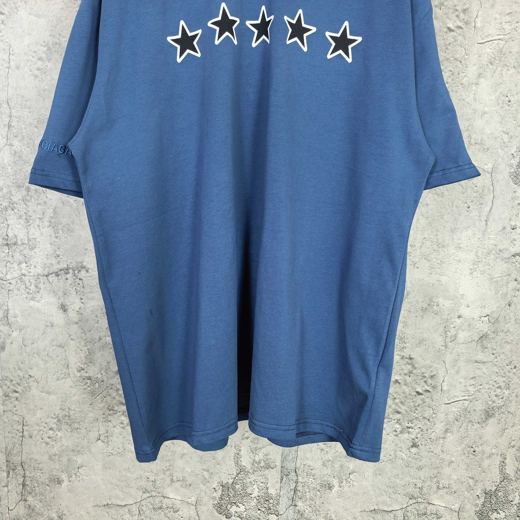 Balenciaga short-sleeve T-shirt, blue; white stars print near neckline, full front view.