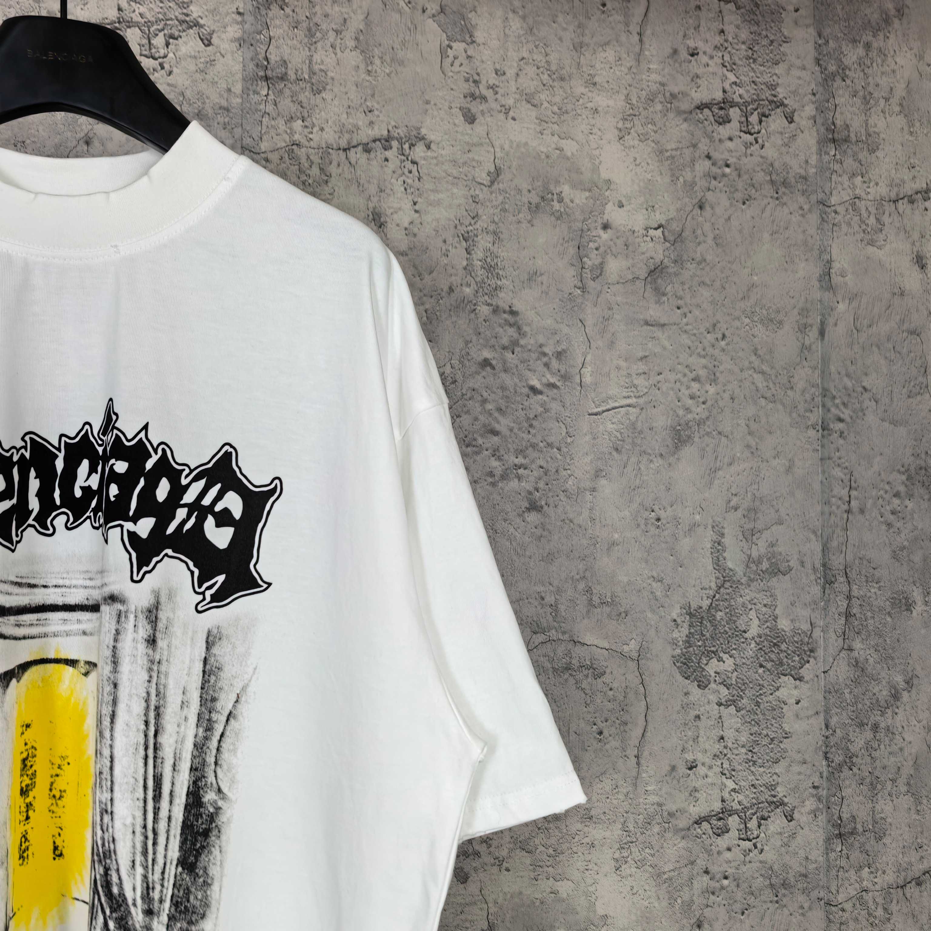 Balenciaga white T-shirt close-up of side print with black banner and yellow block