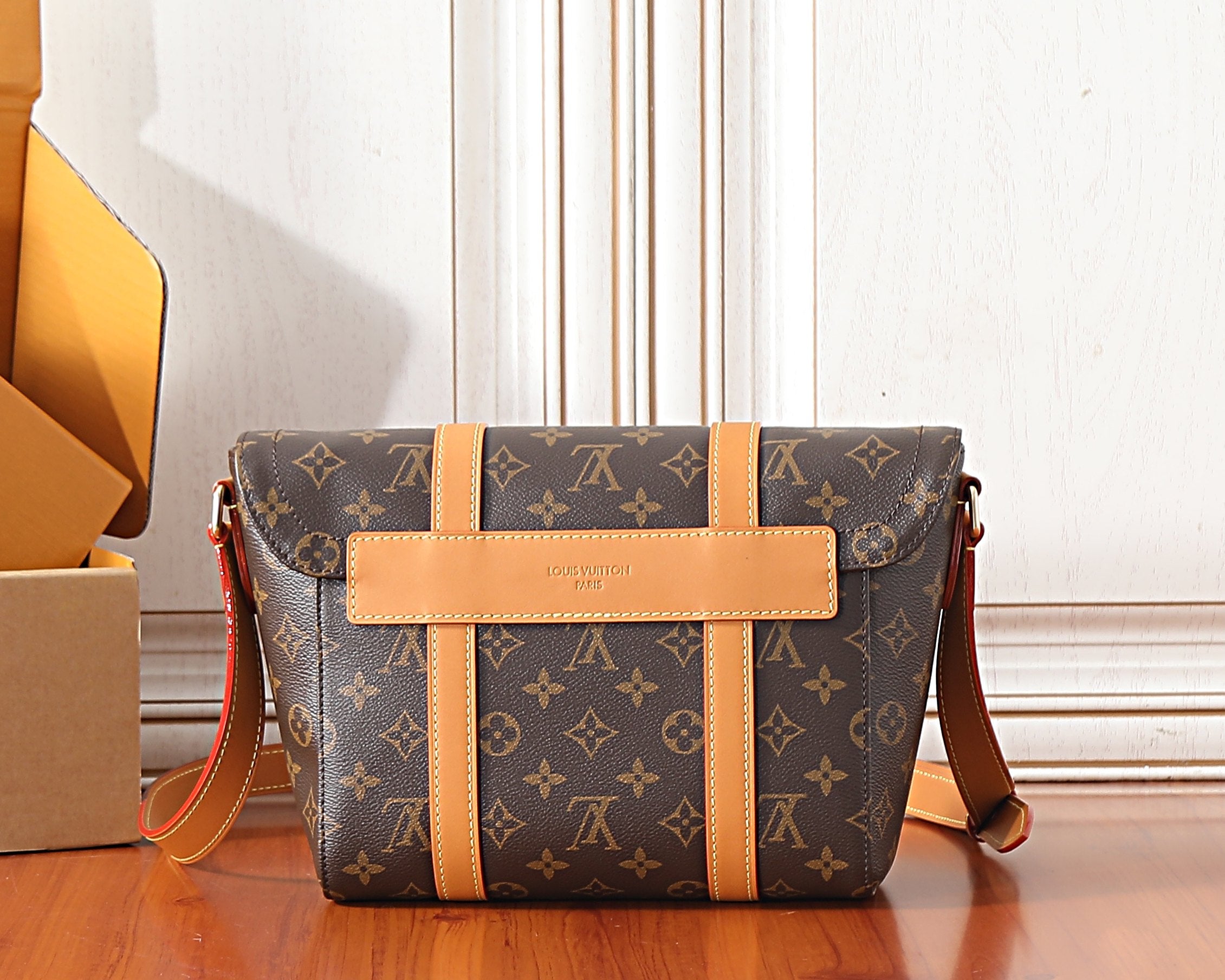 Monogram crossbody bag with wide tan center panel and top handle