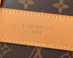 Leather logo patch with stitched trim on monogram crossbody bag edge
