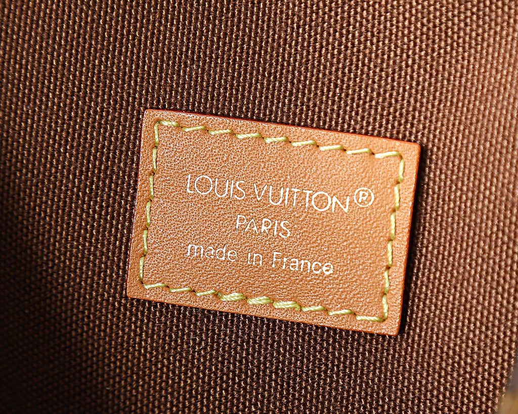 Leather interior label reading Paris and made in France on monogram bag