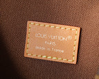 Leather interior label reading Paris and made in France on monogram bag