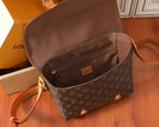 Monogram crossbody bag with open top pocket and tan leather crossbody strap